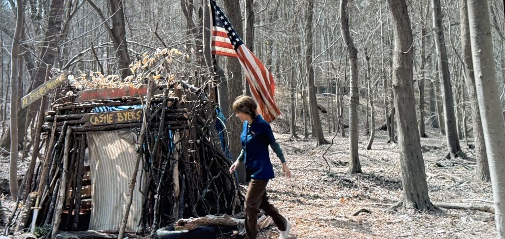 Stranger Things screenshot. Joyce Byers approaches "Castle Byers."